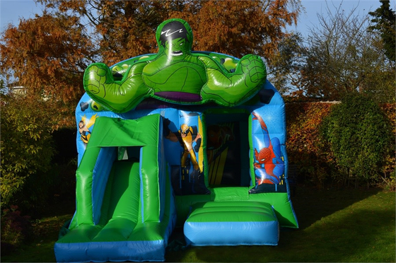 Anak-anak Inflatable Green Super Heroes Castle Jumping House Dengan Slide